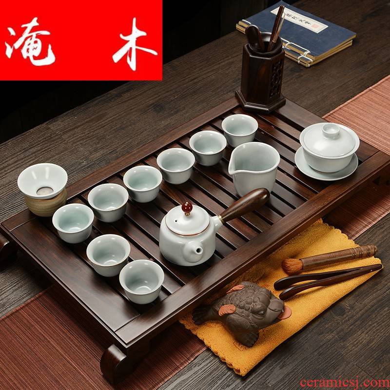 Flooded purple sand pottery and porcelain of a complete set of household solid wood ebony wood tea tray was Chinese tea tea art kung fu tea set