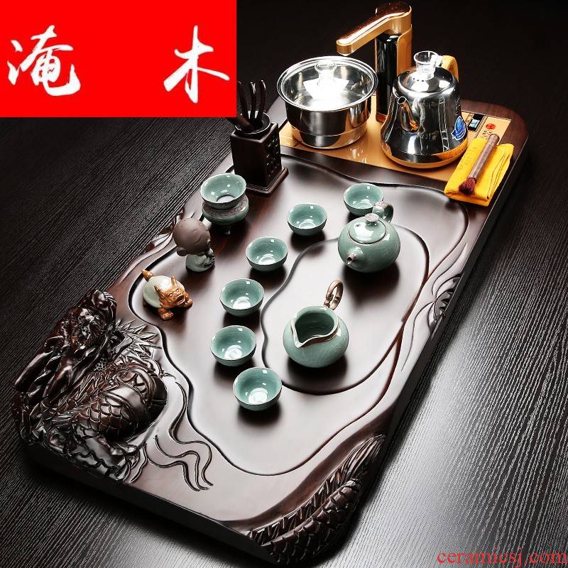 Flooded the whole piece of ebony wood tea tray was the home of a complete set of violet arenaceous kung fu tea set four unity induction cooker tea set