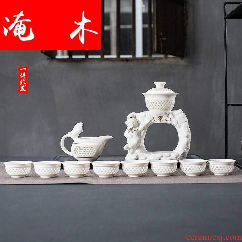 Submerged wood and exquisite hollow out of a complete set of semi - automatic kung fu tea set tureen tea art ceramic creative teacups premium gift