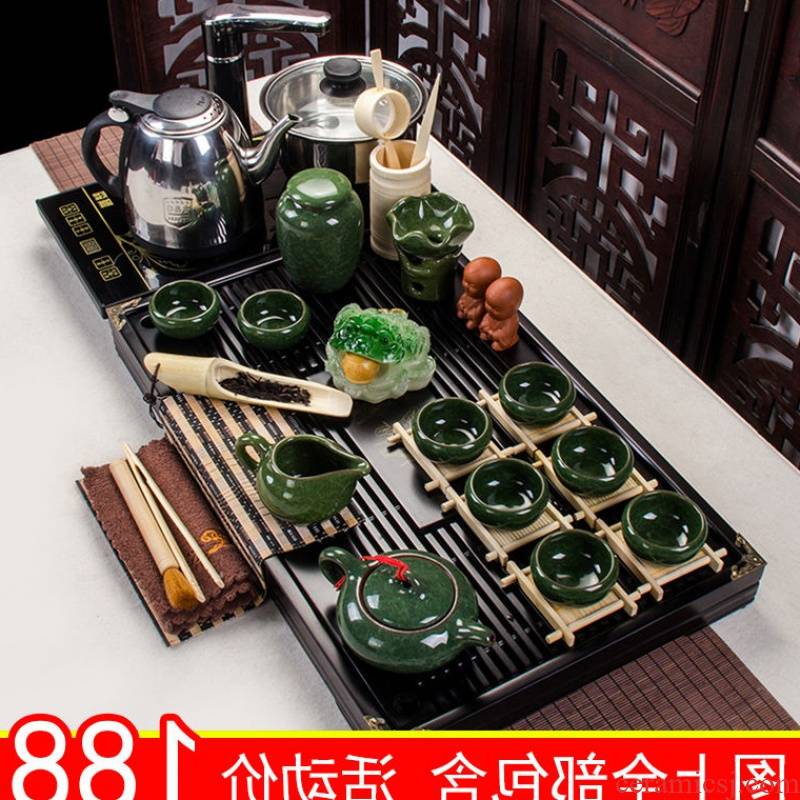 The kitchen kung fu tea set of household ceramic with a complete set of automatic solid wood tea tray was purple sand teapot teacup